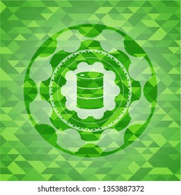 barrel icon inside green emblem with triangle mosaic background