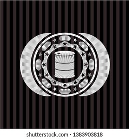 barrel icon inside silvery emblem or badge