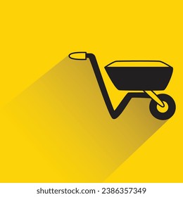 barrow with shadow on yellow background