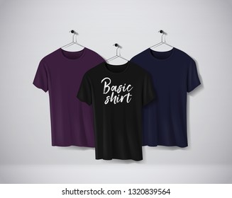 Basic color short sleeve T-Shirts Mock-up clothes set hanging isolated on wall. Front side view with lettering for your design or logo. 