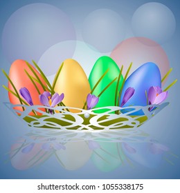 Basket of Easter eggs in the snowdrops