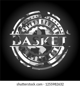 Basket on grey camouflaged texture