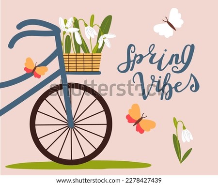 Basket with snowdrops on a bicycle. First spring flowers. Spring mood greeting card template.