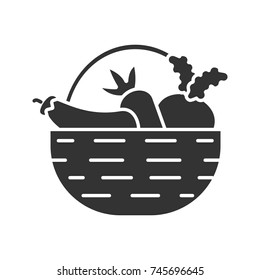 Basket with vegetables glyph icon. Autumn harvest. Carrot, eggplant, beetroot. Silhouette symbol. Negative space. Vector isolated illustration