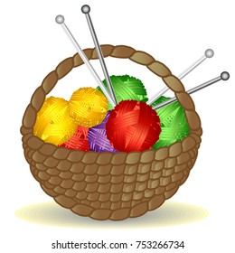 Basket from the vine with a handle full of coils of multicolored yarn, thread and knitting needles