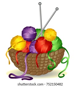 Basket from the vine without a handle full of coils of multicolored yarn, thread and knitting needles