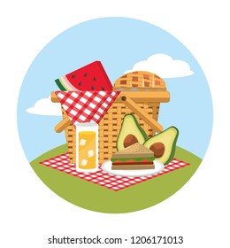 basket with watermelon and sandwich food in the tablecloth