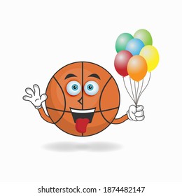 Basketball mascot character holding a balloon. vector illustration