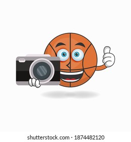 Basketball mascot character holding camera. vector illustration