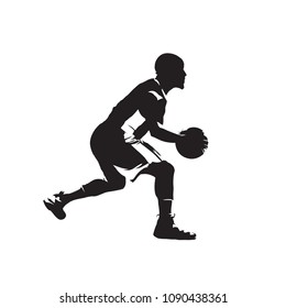 Basketball player with ball, crossover dribble, isolated vector silhouette