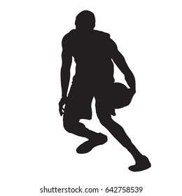 Basketball player crossover dribbling, vector silhouette
