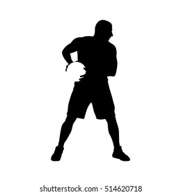 Basketball player standing and holding ball in his hands, vector silhouette