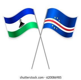 Basotho and Cabo Verdean crossed flags. Lesotho combined with Cabo Verde isolated on white. Language learning, international business or travel concept.