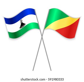 Basotho and Congolese crossed flags. Lesotho combined with Republic of the Congo isolated on white. Language learning, international business or travel concept.