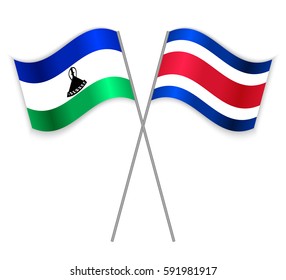Basotho and Costa Rican crossed flags. Lesotho combined with Costa Rica isolated on white. Language learning, international business or travel concept.