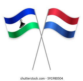 Basotho and Dutch crossed flags. Lesotho combined with Netherlands isolated on white. Language learning, international business or travel concept.