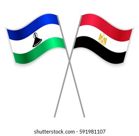 Basotho and Egyptian crossed flags. Lesotho combined with Egypt isolated on white. Language learning, international business or travel concept.