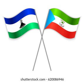 Basotho and Equatorial Guinean crossed flags. Lesotho combined with Equatorial Guinea isolated on white. Language learning, international business or travel concept.