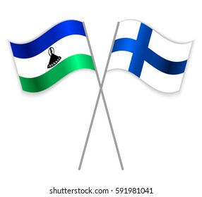 Basotho and Finnish crossed flags. Lesotho combined with Finland isolated on white. Language learning, international business or travel concept.