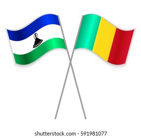 Basotho and Guinean crossed flags. Lesotho combined with Guinea isolated on white. Language learning, international business or travel concept.