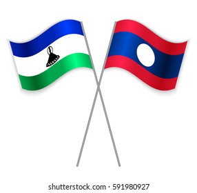 Basotho and Laotian crossed flags. Lesotho combined with Laos isolated on white. Language learning, international business or travel concept.