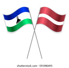 Basotho and Latvian crossed flags. Lesotho combined with Latvia isolated on white. Language learning, international business or travel concept.