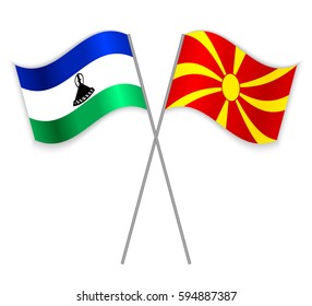 Basotho and Macedonian crossed flags. Lesotho combined with Macedonia isolated on white. Language learning, international business or travel concept.