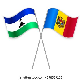 Basotho and Moldovan crossed flags. Lesotho combined with Moldova isolated on white. Language learning, international business or travel concept.