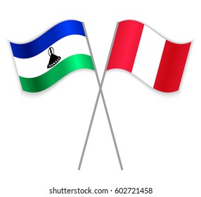 Basotho and Peruvian crossed flags. Lesotho combined with Peru isolated on white. Language learning, international business or travel concept.