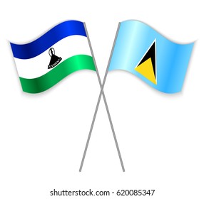 Basotho and Saint Lucian crossed flags. Lesotho combined with Saint Lucia isolated on white. Language learning, international business or travel concept.
