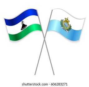 Basotho and Sammarinese crossed flags. Lesotho combined with San Marino isolated on white. Language learning, international business or travel concept.