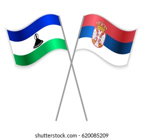 Basotho and Serbian crossed flags. Lesotho combined with Serbia isolated on white. Language learning, international business or travel concept.