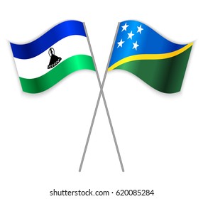 Basotho and Solomon Island crossed flags. Lesotho combined with Solomon Islands isolated on white. Language learning, international business or travel concept.