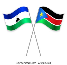 Basotho and South Sudanese crossed flags. Lesotho combined with South Sudan isolated on white. Language learning, international business or travel concept.