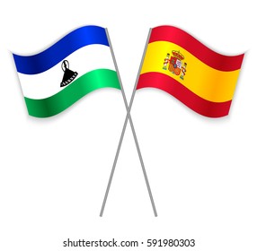 Basotho and Spanish crossed flags. Lesotho combined with Spain isolated on white. Language learning, international business or travel concept.