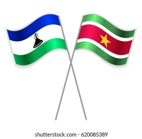 Basotho and Surinamese crossed flags. Lesotho combined with Suriname isolated on white. Language learning, international business or travel concept.