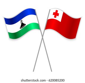 Basotho and Tongan crossed flags. Lesotho combined with Tonga isolated on white. Language learning, international business or travel concept.