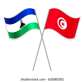 Basotho and Tunisian crossed flags. Lesotho combined with Tunisia isolated on white. Language learning, international business or travel concept.