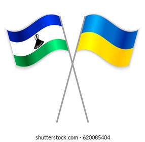 Basotho and Ukrainian crossed flags. Lesotho combined with Ukraine isolated on white. Language learning, international business or travel concept.