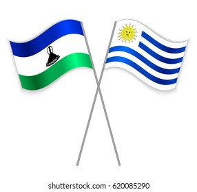Basotho and Uruguayan crossed flags. Lesotho combined with Uruguay isolated on white. Language learning, international business or travel concept.