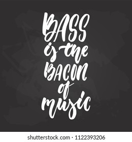 Bass is the bacon of music - hand drawn Musical lettering phrase isolated on the black chalkboard background. Fun brush chalk vector quote for banners, poster design, photo overlays.