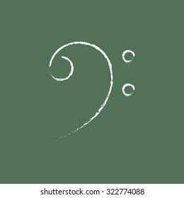 Bass clef hand drawn in chalk on a blackboard vector white icon isolated on a green background.