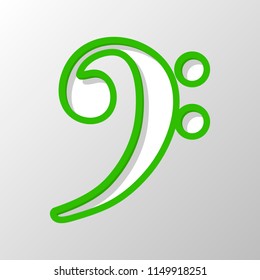Bass Clef icon. Paper style. Cut symbol with green bold contour on shape and simple shadow