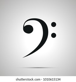 Bass clef silhouette, simple black icon with shadow