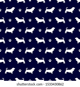 Basset hound dog breed seamless pattern in dark navy blue colored background. Dog paw print seamless pattern.