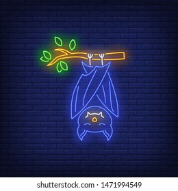 Bat hanging on tree branch neon sign. Halloween, animal, advertisement design. Night bright neon sign, colorful billboard, light banner. Vector illustration in neon style.