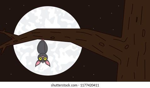 Bat hung head down on a branch on a full moon night on halloween.
