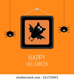 Bat in picture frame on nail. Hanging spiders. Happy Halloween card. Orange background Flat design Vector illustration