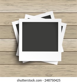 Batched photo frames with camera icons on the wooden background. Eps 10 vector file.