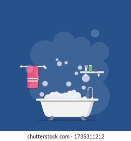 Bath with foam bubbles inside, with a towel and bath accessories, isolated, on a blue background.